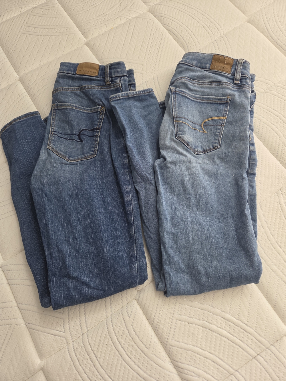 2 American Eagle Outfitters  Skinny Jeans For $13- Dark Blue & Light Blue
